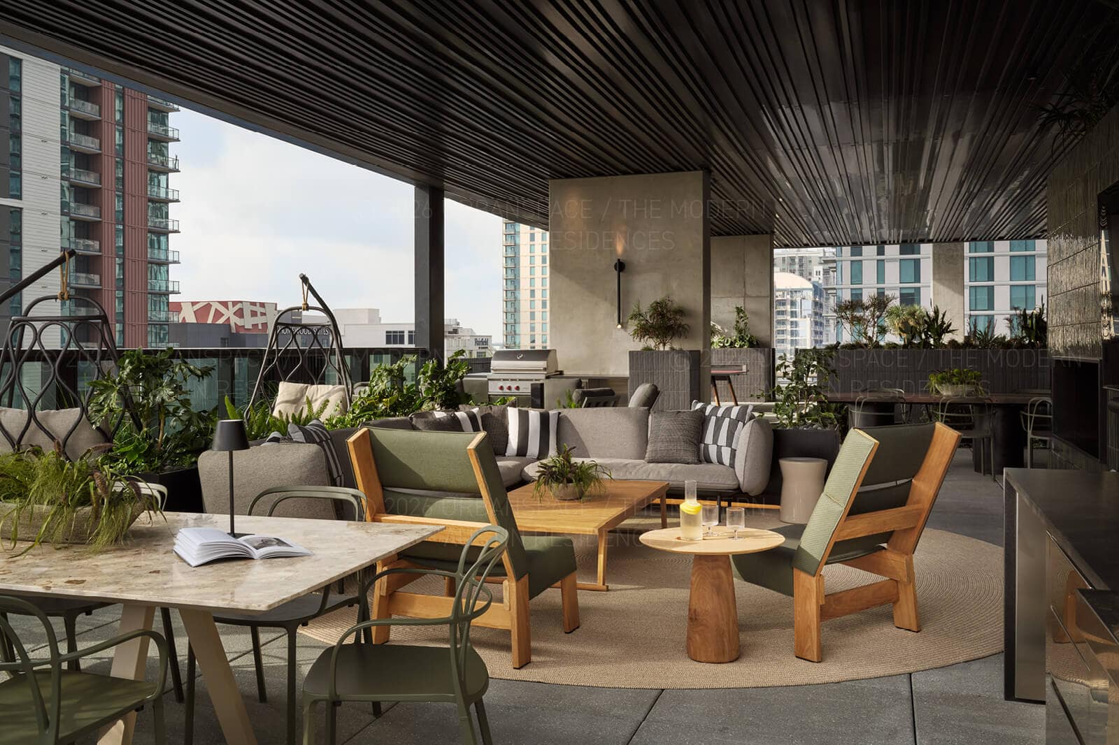 Terrace outdoor kitchen and lounge with the downtown towers beyond