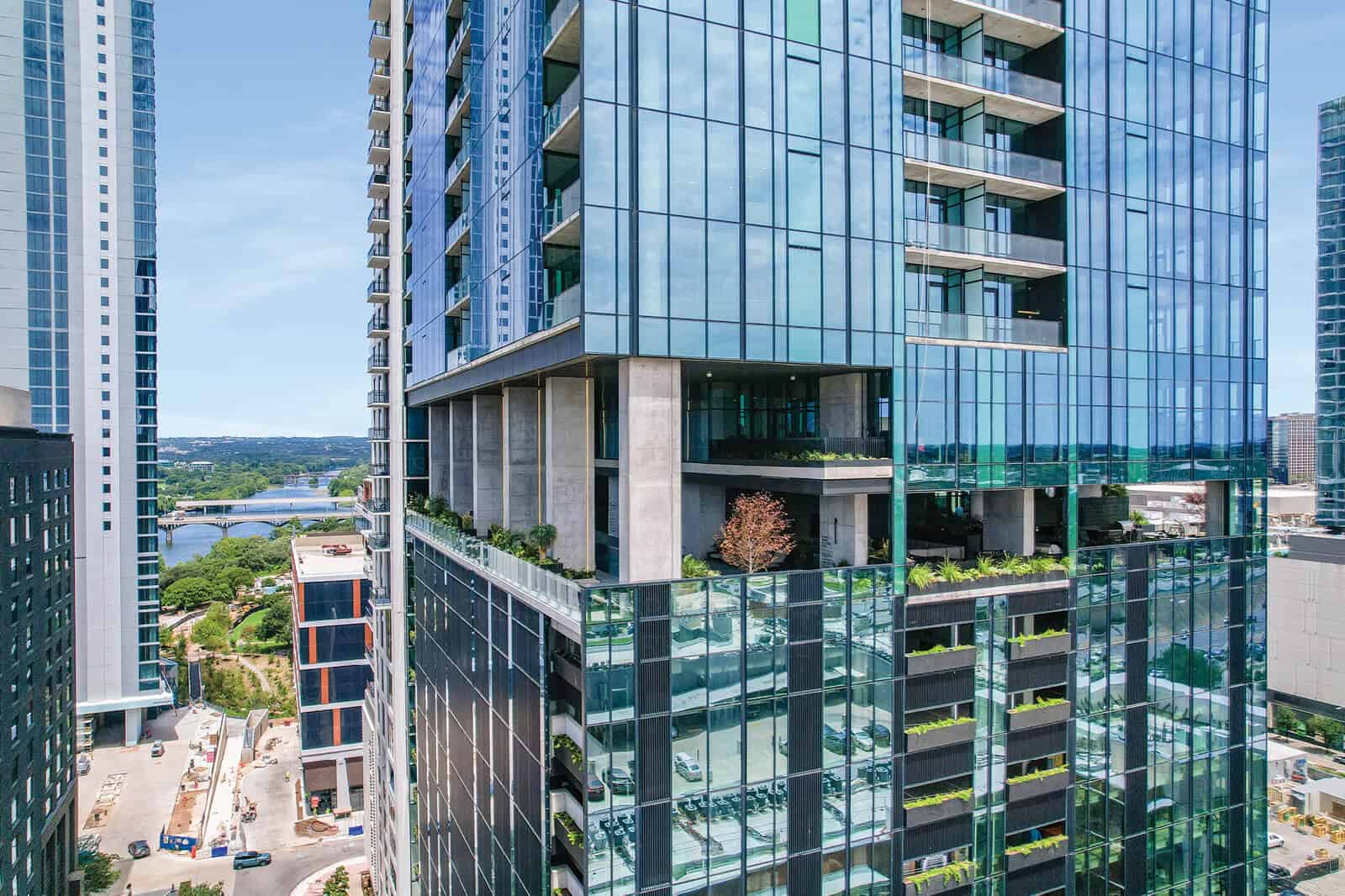 The Modern — the amenity levels seen against the lake and the Austin skyline